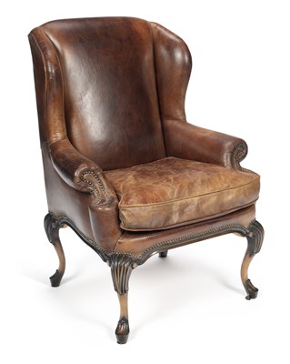 Lot 926 - A LEATHER WING ARMCHAIR IN THE GEORGE II TASTE