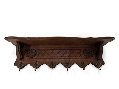 Lot 902 - A CARVED OAK WALL SHELF AND COAT RACK