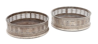 Lot 367 - A PAIR OF GEORGE III SILVER WINE BOTTLE COASTERS
