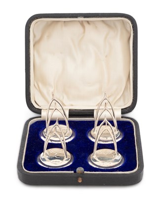 Lot 260 - A CASED SET OF FOUR GEORGE V SILVER NOVELTY MENU HOLDERS