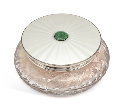 Lot 247 - AN ELIZABETH II SILVER, ENAMEL AND JADE TOPPED CUT-GLASS DRESSING TABLE JAR