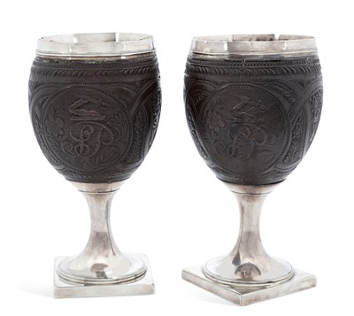 Lot 376 - A PAIR OF GEORGE III SILVER-MOUNTED COCONUT CUPS