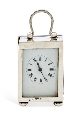 Lot 305 - A GEORGE V SILVER-CASED TRAVELLING CLOCK