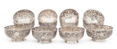 Lot 199 - A SET OF TWELVE CHINESE EXPORT SILVER PIERCED BOWLS