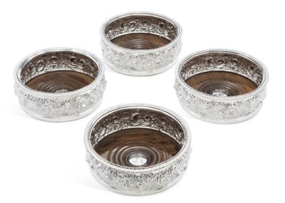 Lot 371 - A SET OF FOUR GEORGE III SILVER WINE COASTERS