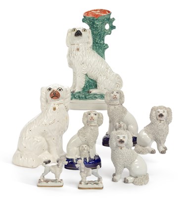 Lot 120 - A PAIR OF STAFFORDSHIRE POTTERY POODLES