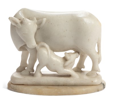 Lot 702 - AN ALABASTER COW AND CALF GROUP