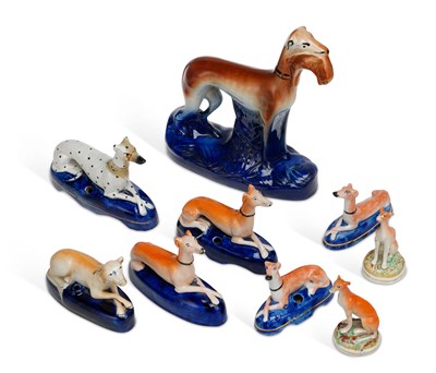 Lot 136 - A GROUP OF STAFFORDSHIRE POTTERY GREYHOUNDS