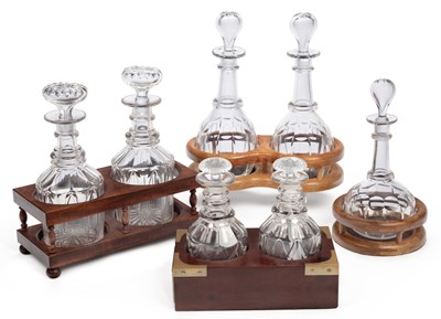 Lot 73 - SEVEN CUT-GLASS DECANTERS AND FOUR STANDS