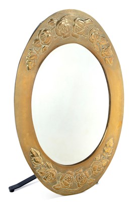 Lot 957 - AN ARTS AND CRAFTS BRASS OVAL WALL MIRROR