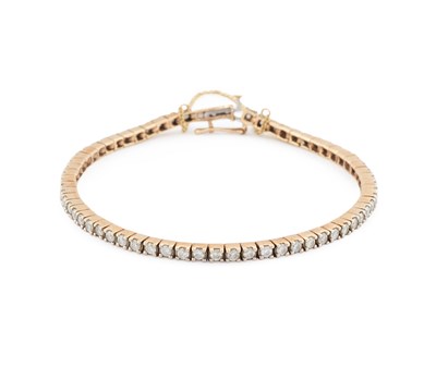 Lot 573 - A 9 CARAT GOLD DIAMOND TENNIS BRACELET