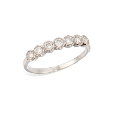 Lot 606 - A DIAMOND HALF HOOP RING