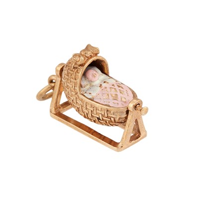 Lot 630 - A 9 CARAT GOLD PINK ENAMEL CRADLE PENDANT CHARM