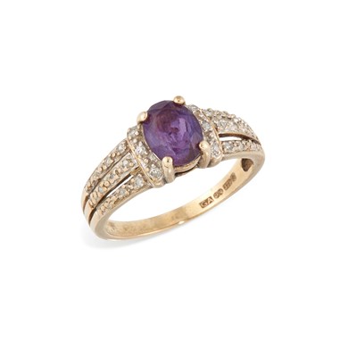 Lot 527 - A 9 CARAT GOLD AMETHYST AND DIAMOND RING