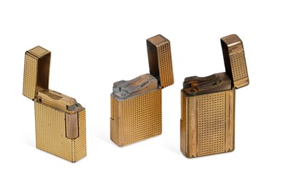 Lot 693 - THREE S.T. DUPONT GOLD PLATED LIGHTERS