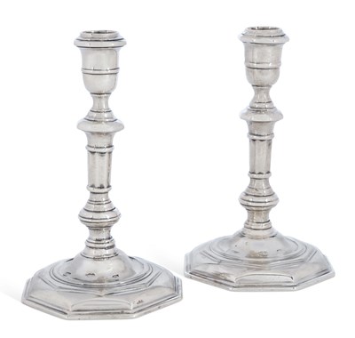 Lot 238 - A PAIR OF IRISH CAST SILVER CANDLESTICKS