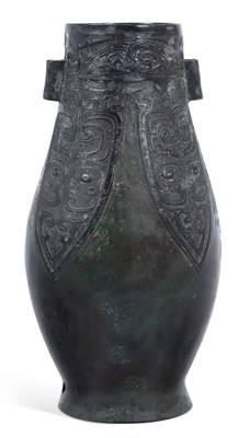 Lot 425 - AN ARCHAISTIC CHINESE BRONZE HU VASE