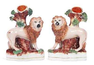 Lot 111 - A PAIR OF STAFFORDSHIRE LION SPILL VASES