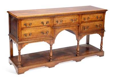 Lot 928 - A GEORGE III STYLE OAK DRESSER BASE