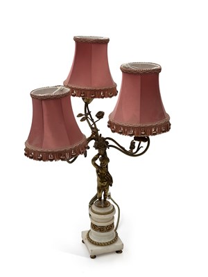 Lot 821 - A FRENCH GILT METAL AND WHITE MARBLE FIGURAL TABLE LAMP