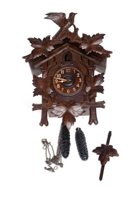 Lot 837 - A LATE 19TH CENTURY BLACK FOREST CARVED CUCKOO CLOCK