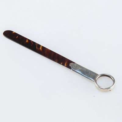 Lot 1154 - A GEORGE V SILVER-MOUNTED TORTOISESHELL PAGE TURNER