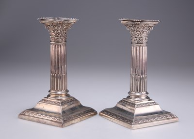 Lot 1093 - A PAIR OF LATE VICTORIAN SILVER CORINTHIAN COLUMN CANDLESTICKS