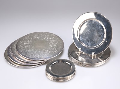 Lot 1450 - A GROUP OF FIFTEEN SILVER-PLATED COASTERS, TOGETHER WITH A SET OF FOUR SILVER-PLATED TABLE MATS