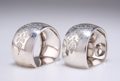 Lot 1447 - A PAIR OF VICTORIAN ENGRAVED SILVER NAPKIN RINGS